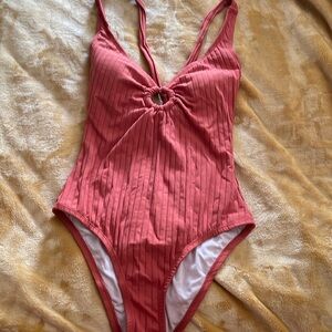 One-piece burnt orange swimsuit with built in padding and open back